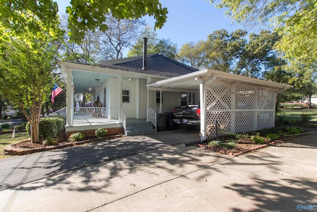 exterior space featuring covered porch and a carport