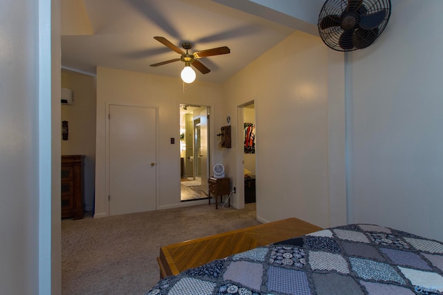 bedroom with ceiling fan, carpet floors, and ensuite bath