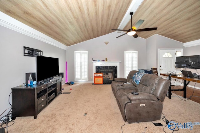 living room featuring carpet floors, wooden ceiling, a ceiling fan, and a premium fireplace