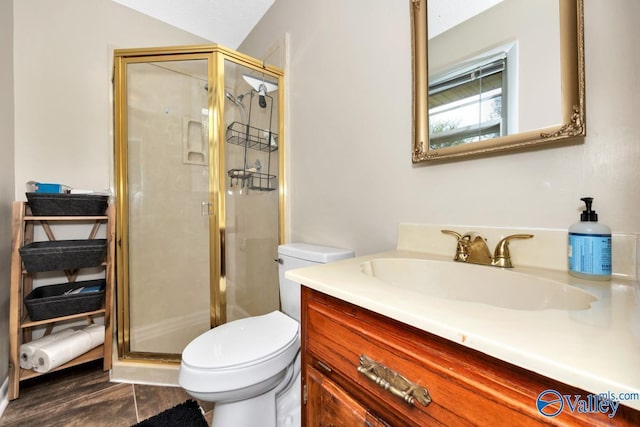 full bath featuring vanity, a stall shower, toilet, lofted ceiling, and wood finished floors