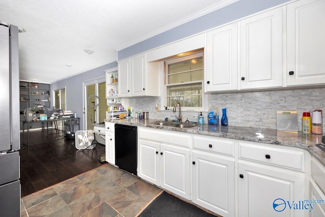 kitchen with stainless steel refrigerator, white cabinetry, a sink, and black dishwasher