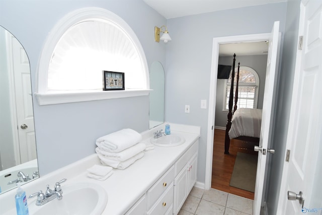 bathroom with vanity and tile patterned flooring