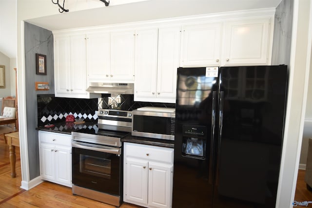 kitchen featuring white cabinetry, stainless steel appliances, backsplash, and light wood-type flooring