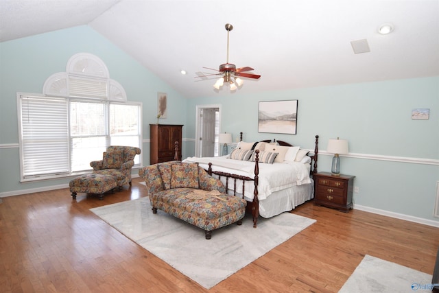 bedroom with wood-type flooring, ceiling fan, and high vaulted ceiling