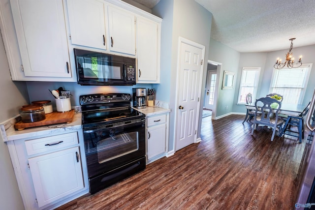 kitchen featuring white cabinetry, a notable chandelier, black appliances, and dark wood-type flooring