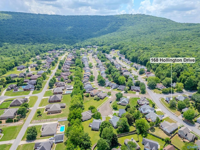 bird's eye view featuring a wooded view