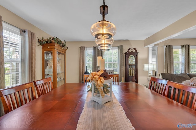 dining room with a wealth of natural light and a chandelier