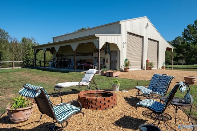 view of patio with an outdoor fire pit