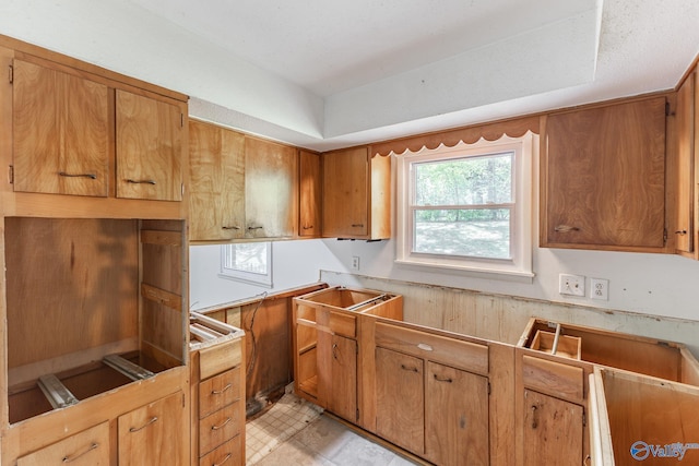 kitchen featuring brown cabinetry