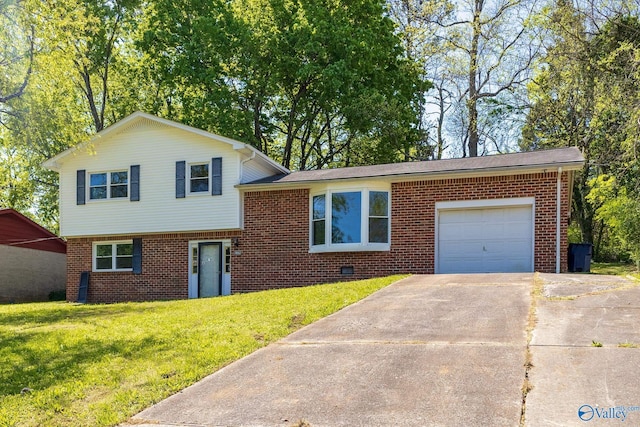 tri-level home featuring driveway, a front lawn, brick siding, and a garage