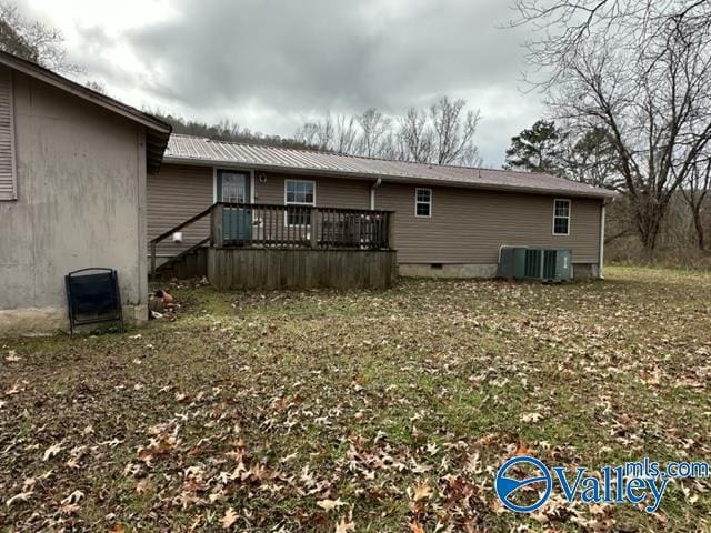 back of property featuring a wooden deck and central AC