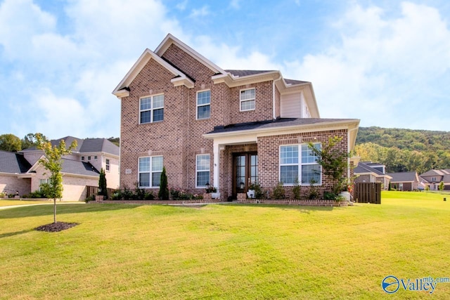 view of front of property featuring french doors and a front yard