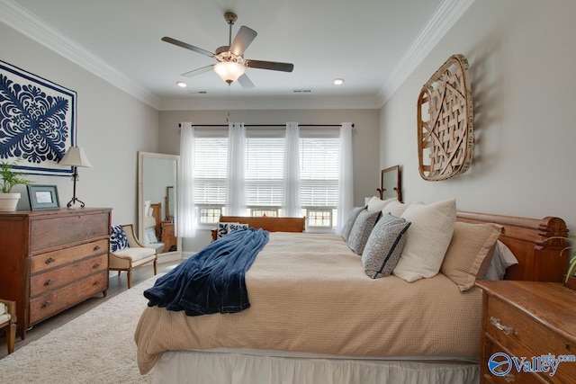 bedroom featuring ceiling fan and crown molding