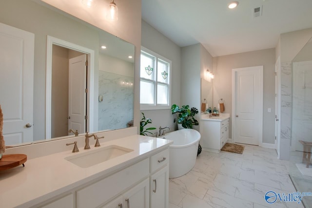 bathroom with independent shower and bath and vanity