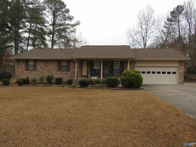 single story home with a garage and a front yard