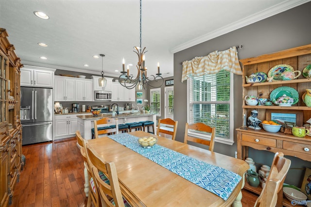 dining space featuring a notable chandelier, dark wood-style flooring, recessed lighting, and ornamental molding