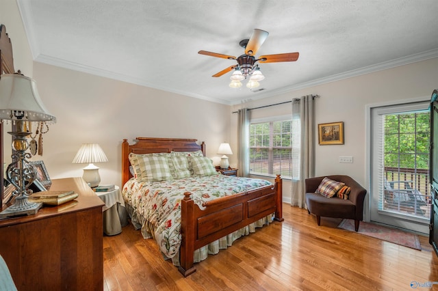 bedroom with access to exterior, light wood-style floors, and ornamental molding