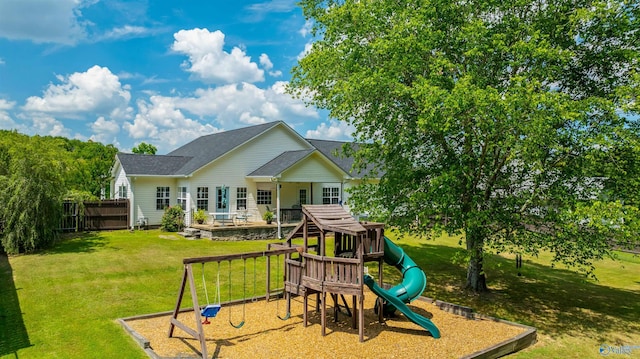 view of play area featuring a lawn and fence