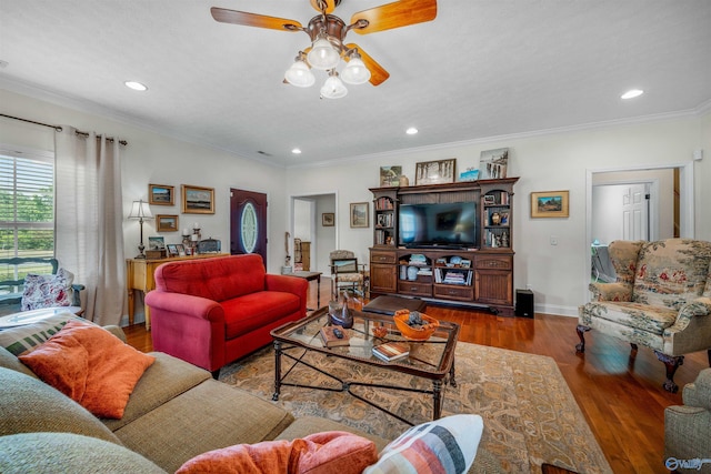 living area with recessed lighting, baseboards, wood finished floors, and crown molding