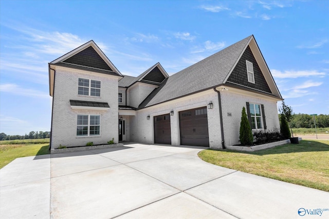 view of front of house with a garage and a front lawn