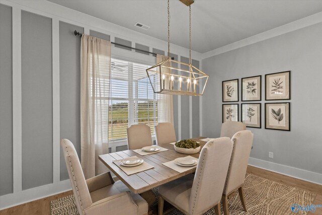 dining room featuring an inviting chandelier and light hardwood / wood-style floors