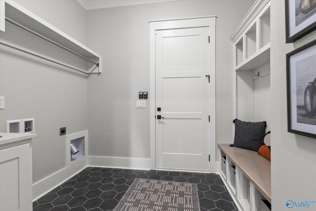 laundry room with washer hookup, hookup for an electric dryer, and dark tile patterned floors