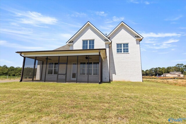 exterior space featuring ceiling fan and a yard