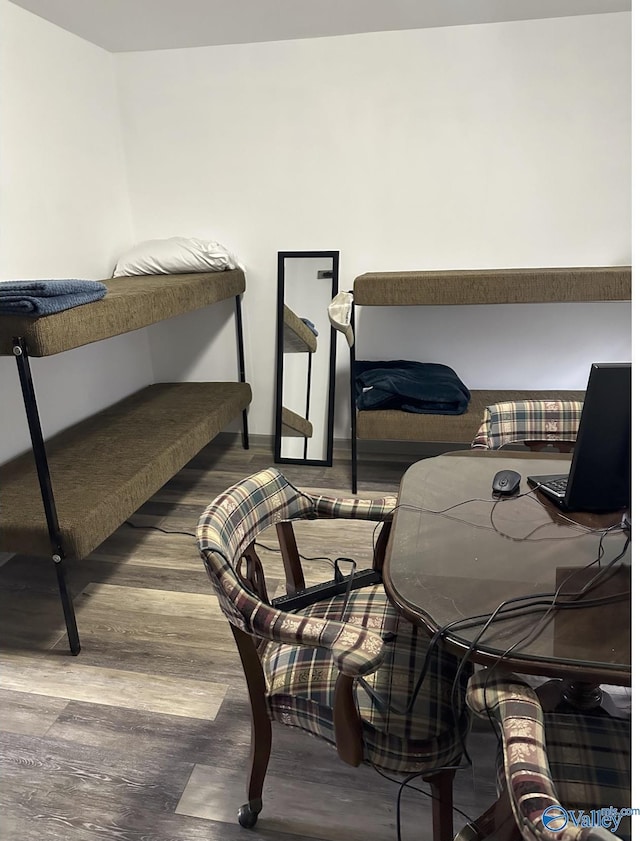 bedroom featuring dark wood-type flooring