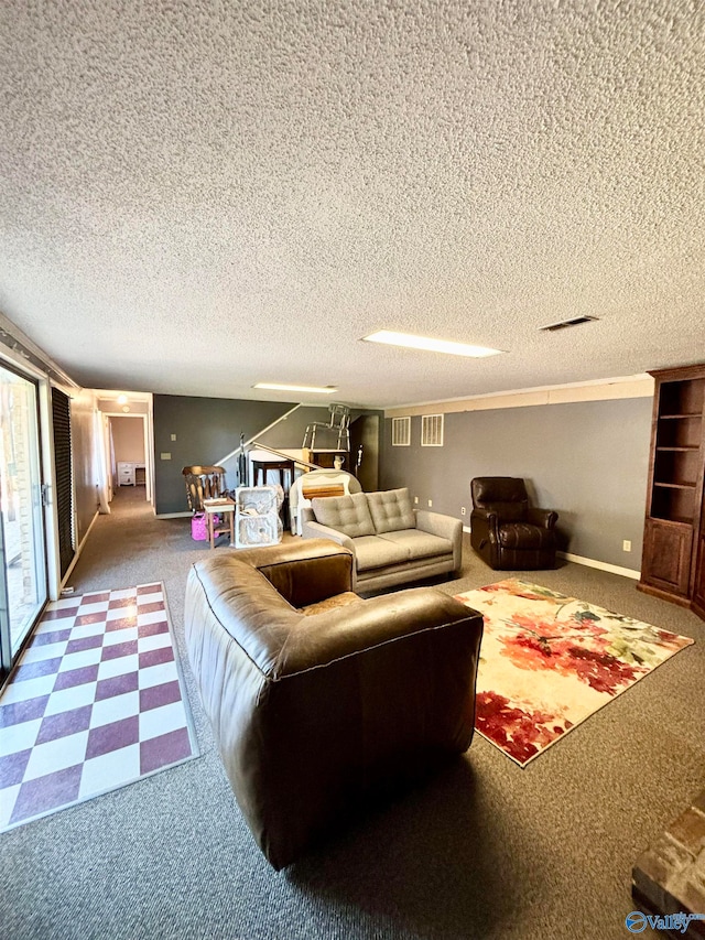 living room featuring carpet flooring and a textured ceiling