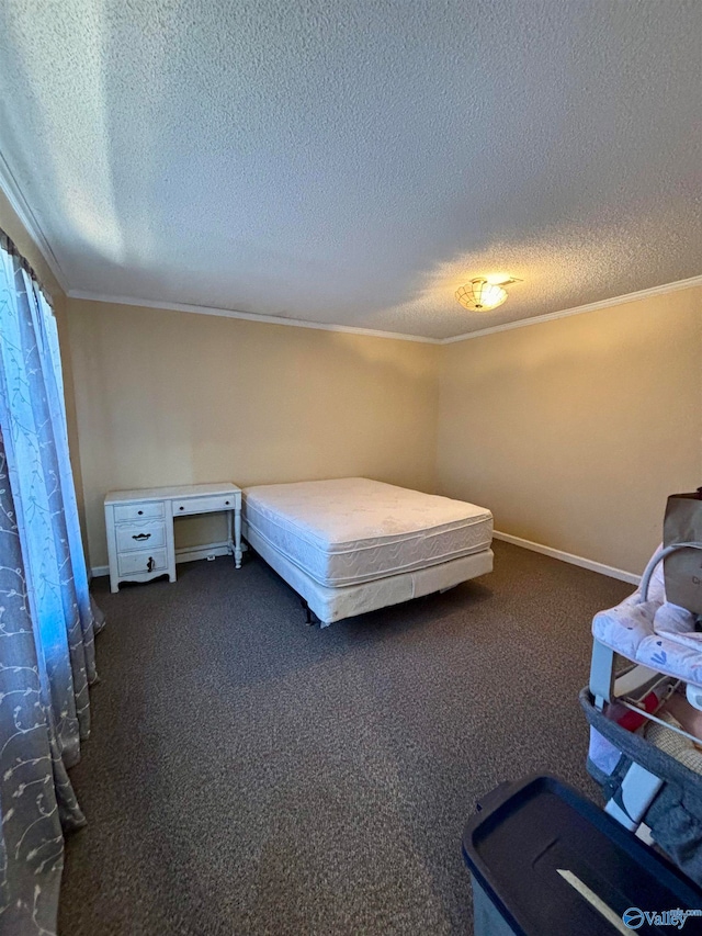 bedroom featuring ornamental molding, dark colored carpet, and a textured ceiling