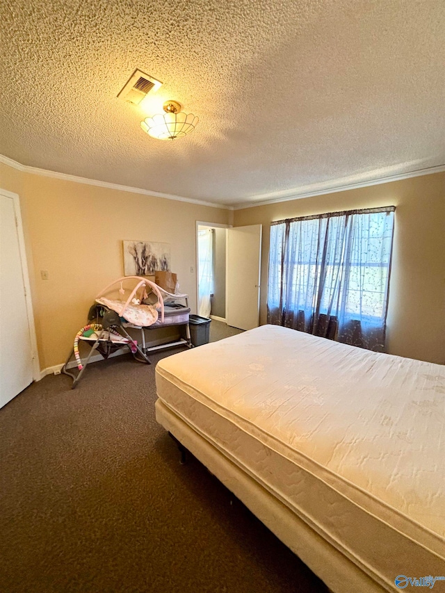 carpeted bedroom with crown molding and a textured ceiling