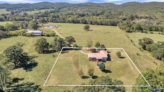 birds eye view of property with a mountain view and a rural view