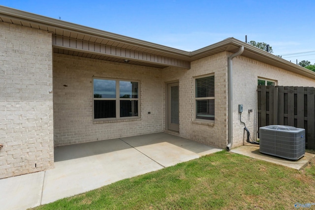 429 Lando Cain Rd, Hartselle, AL 35640 - back of property with cooling unit, a patio area, and brick siding