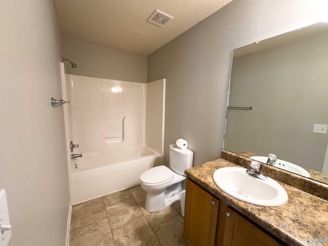 full bathroom with shower / bathtub combination, a textured ceiling, toilet, tile patterned flooring, and vanity