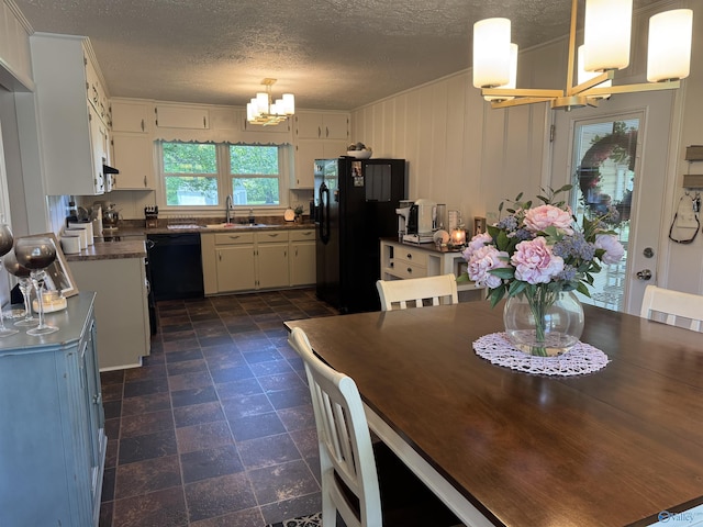 403 Taylor Rd, Glencoe, AL 35905 - dining space featuring a chandelier, crown molding, and a textured ceiling