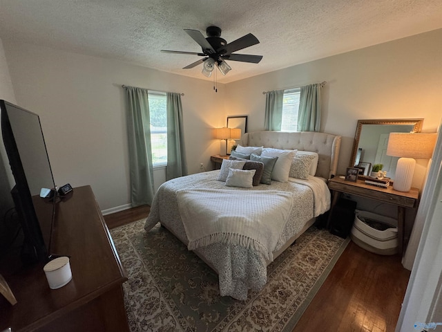 403 Taylor Rd, Glencoe, AL 35905 - bedroom with dark wood-type flooring, a textured ceiling, and a ceiling fan
