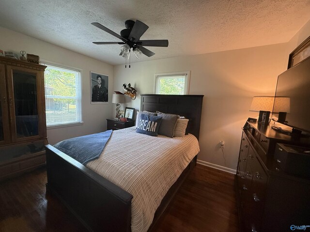 403 Taylor Rd, Glencoe, AL 35905 - bedroom with dark wood-style floors, a textured ceiling, baseboards, and a ceiling fan
