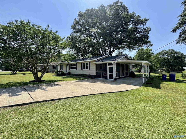 403 Taylor Rd, Glencoe, AL 35905 - back of house with a sunroom, concrete driveway, and an attached carport