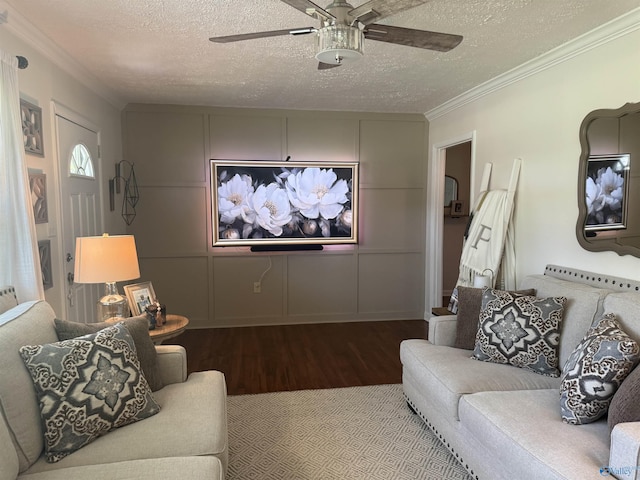 403 Taylor Rd, Glencoe, AL 35905 - living area featuring wood finished floors, a textured ceiling, ceiling fan, ornamental molding, and a decorative wall