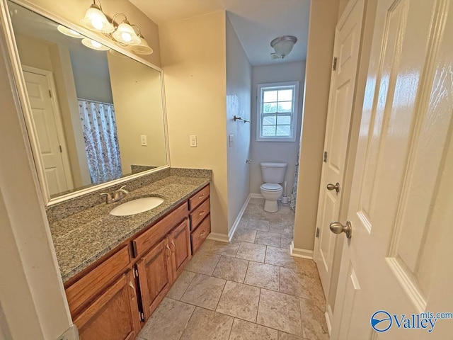 bathroom with toilet and vanity