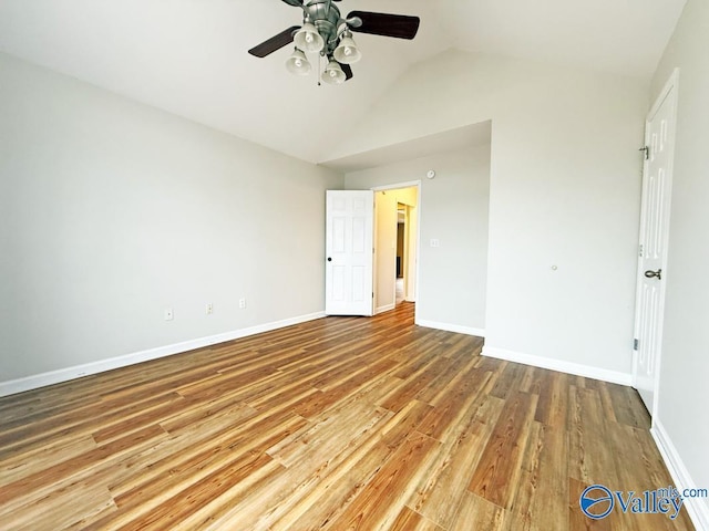 unfurnished bedroom with vaulted ceiling, ceiling fan, and wood-type flooring