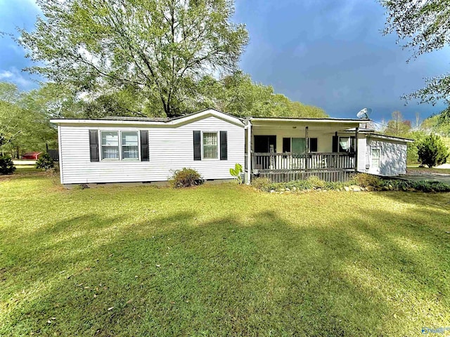 manufactured / mobile home with crawl space, covered porch, and a front yard