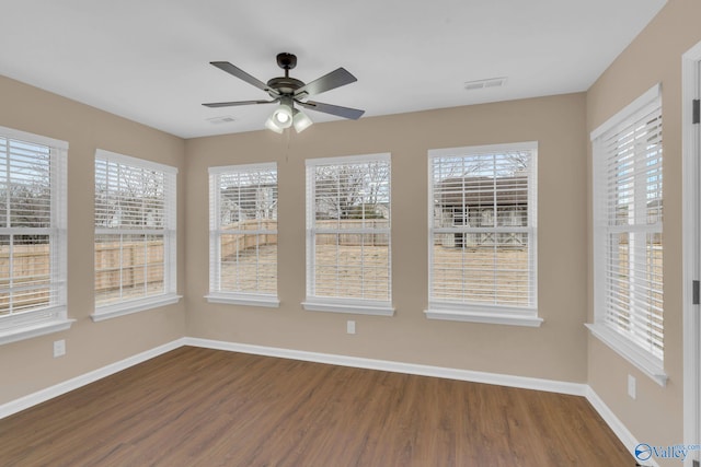 interior space with ceiling fan and wood-type flooring