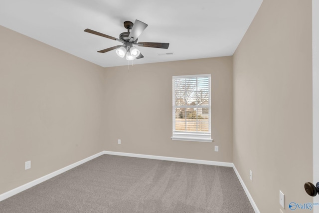 empty room featuring ceiling fan and carpet flooring