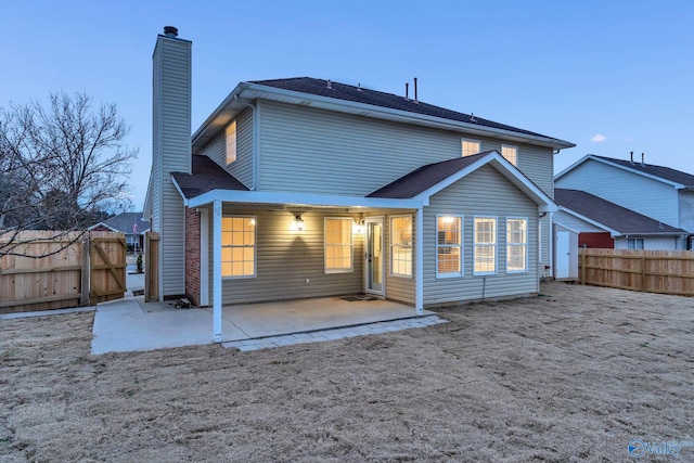 rear view of house featuring a patio