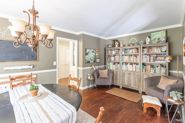 dining area with an inviting chandelier, baseboards, dark wood finished floors, and crown molding