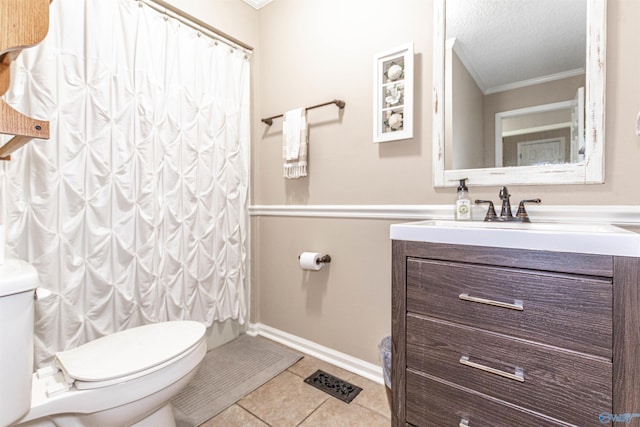 bathroom with toilet, ornamental molding, tile patterned flooring, a textured ceiling, and vanity