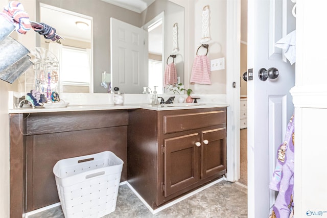 full bath featuring double vanity and a sink