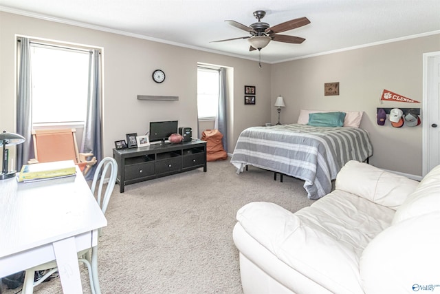 bedroom with ornamental molding, a ceiling fan, and light colored carpet