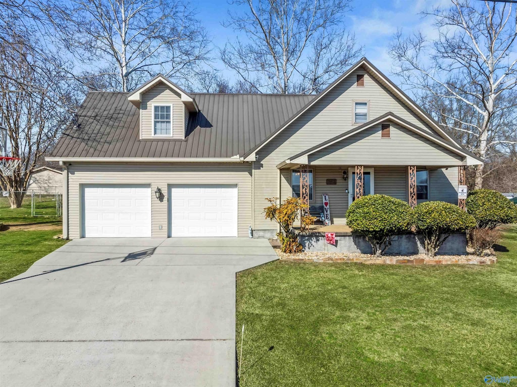 view of front facade with a front yard and a garage